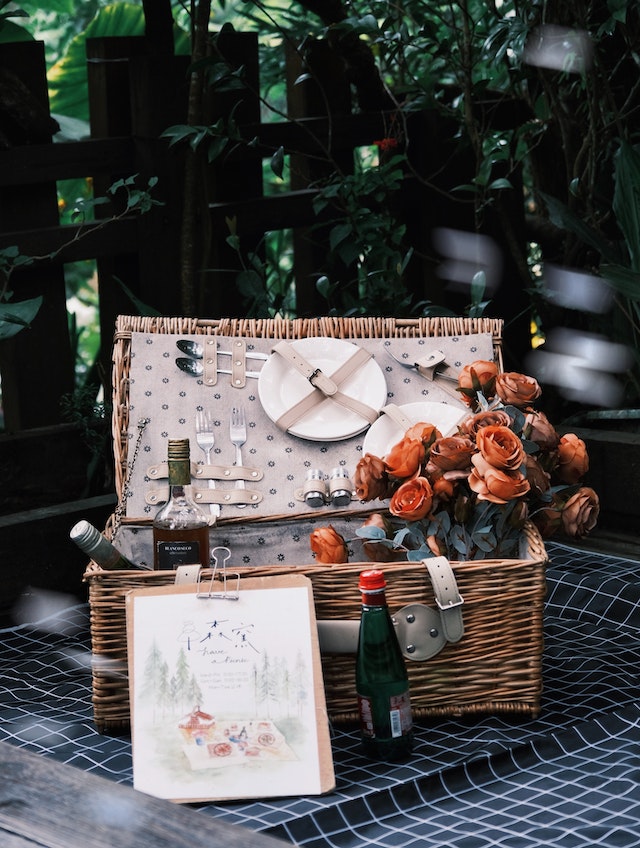 Picnic Basket and Flowers Outdoors