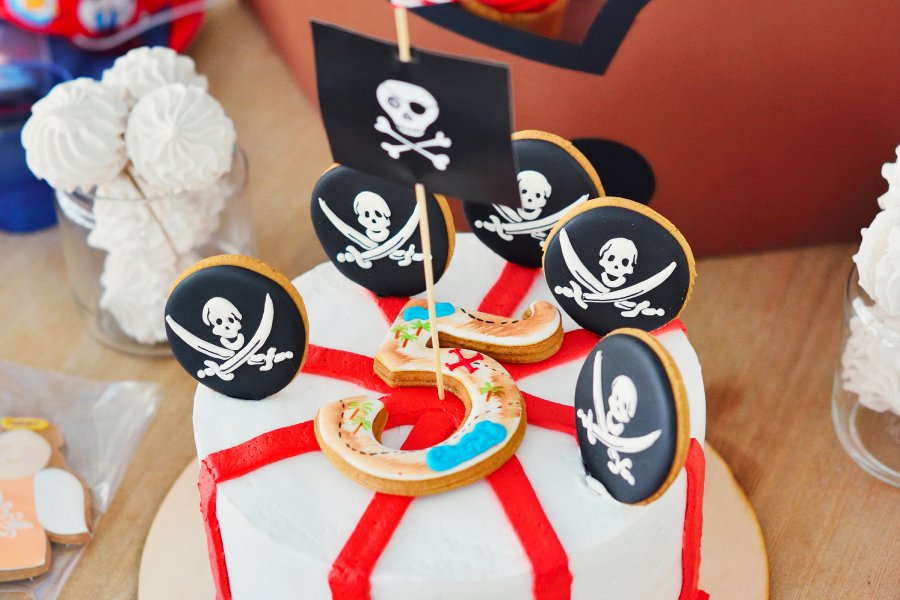 table spread of pirate-themed desserts for a 5-year-old's birthday party.